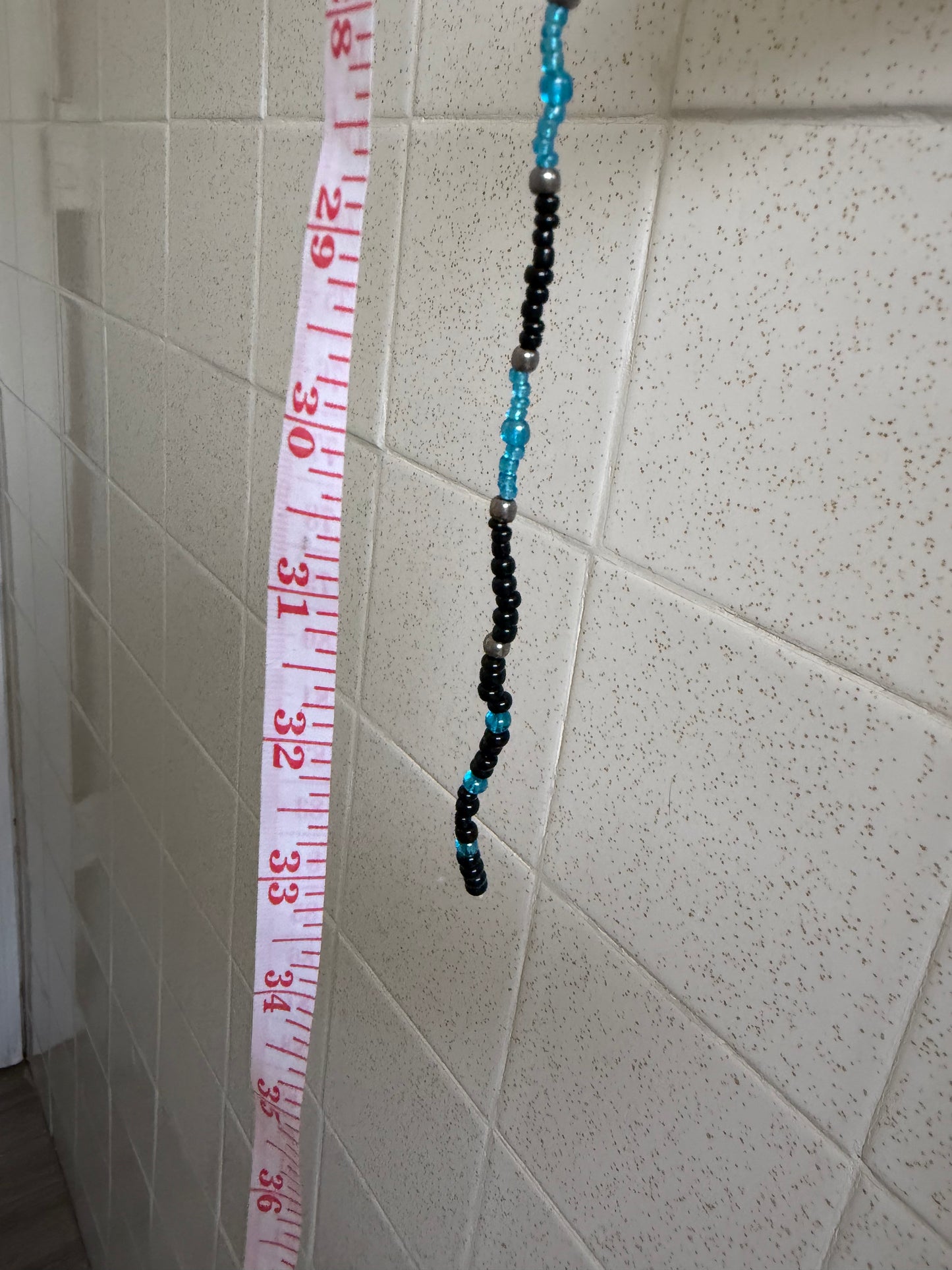 Feather waistbead 33”
